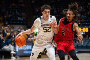WVU men's hoops powers its way to exhibition win over Wheeling University